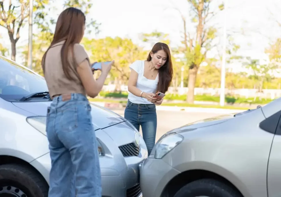 bigstock-Two-Drivers-Check-For-Damage-A-456124847-scaled