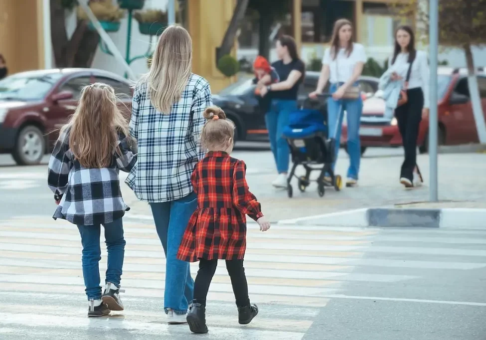 family-crossing-the-road-at-a-pedestrian-crossing-2022-11-15-11-42-41-utc-scaled
